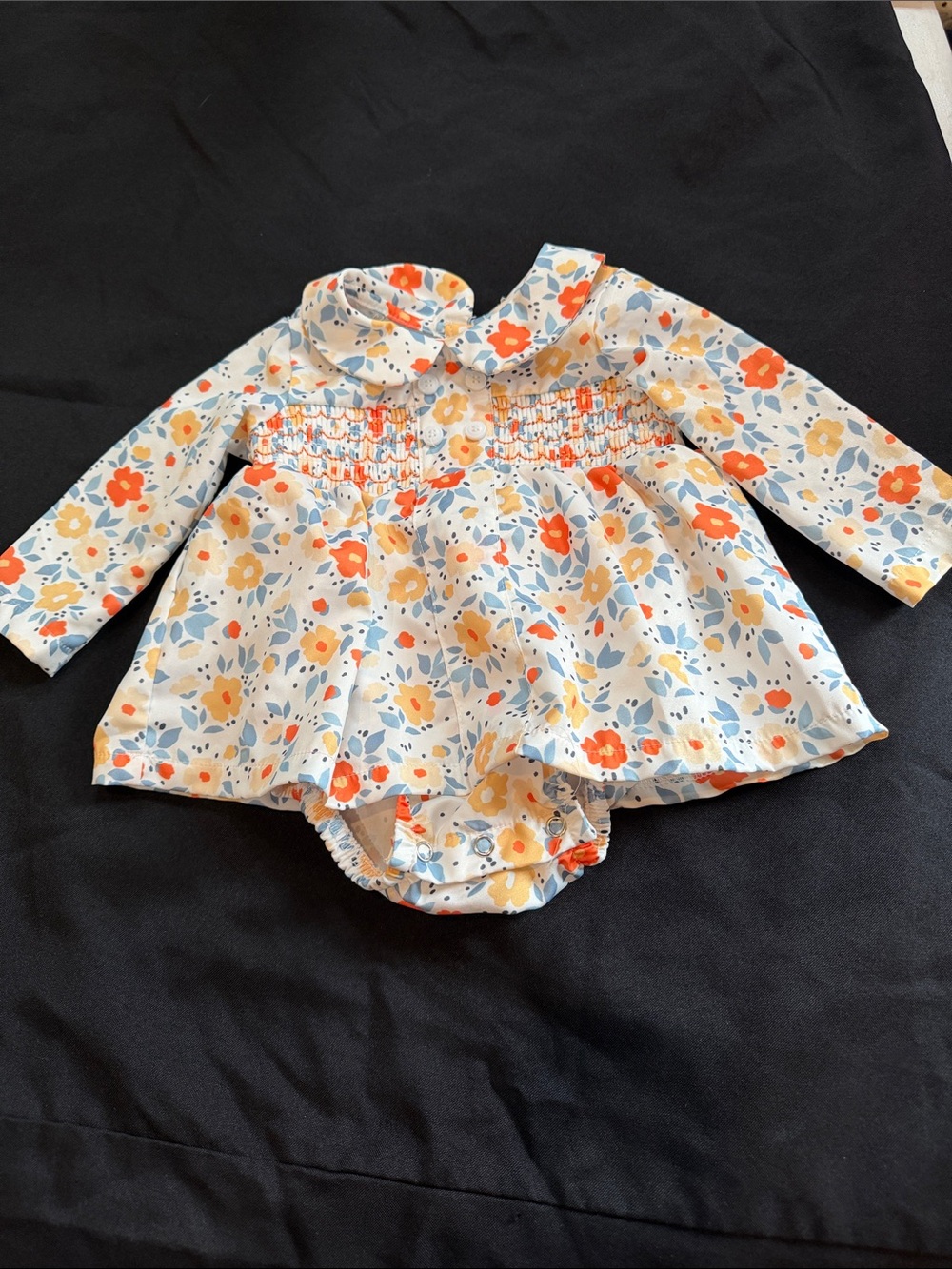 Floral Smocked Long-Sleeve Baby One-Piece in Cream with Orange & Blue Flowers